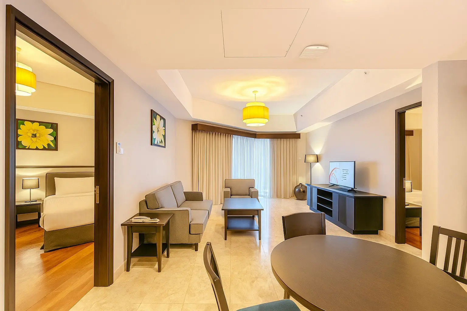 Living and dining area of a 2-bedroom suite