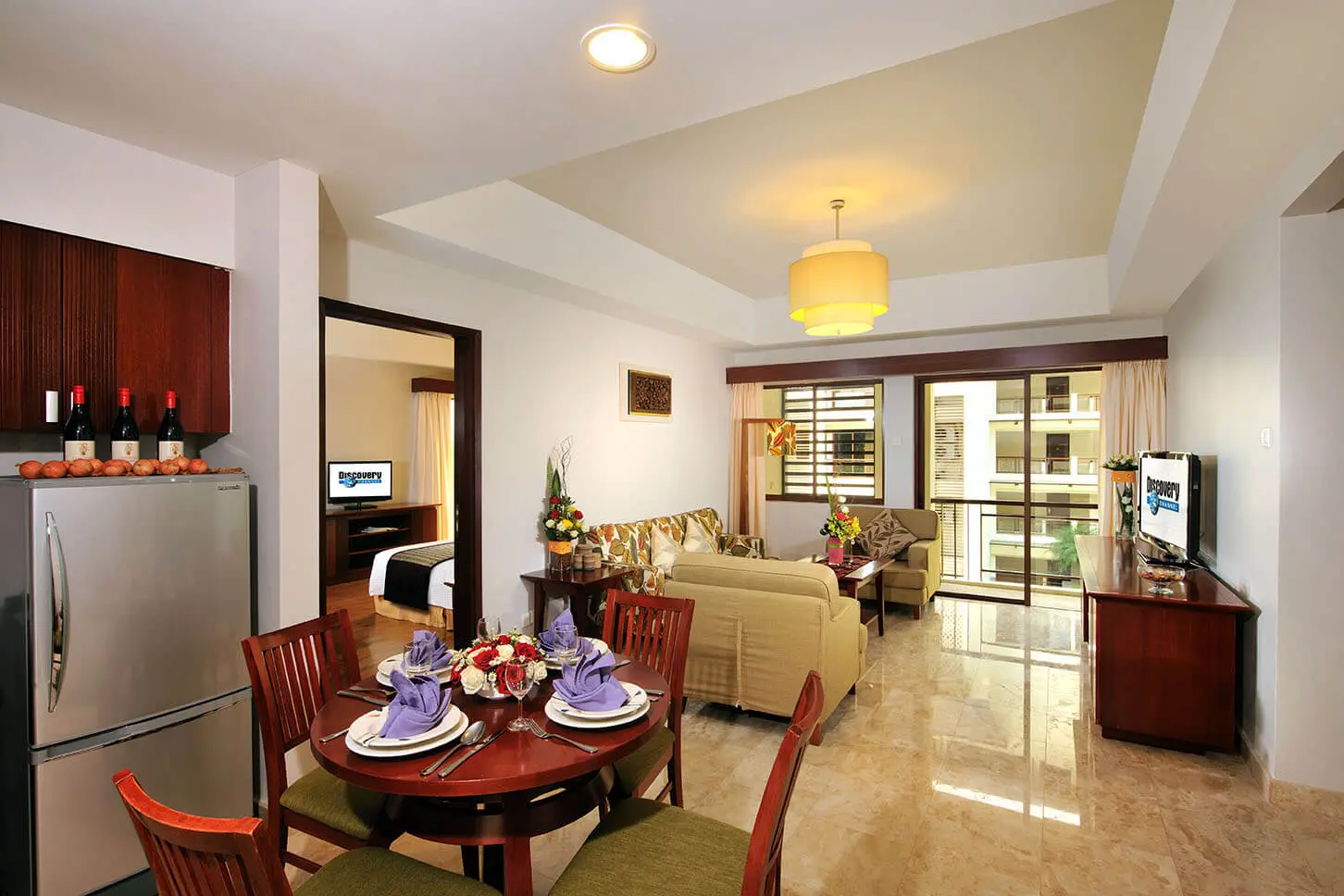 Living and dining area of a 3-bedroom suite